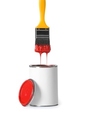 Photo of Open paint can and brush isolated on white