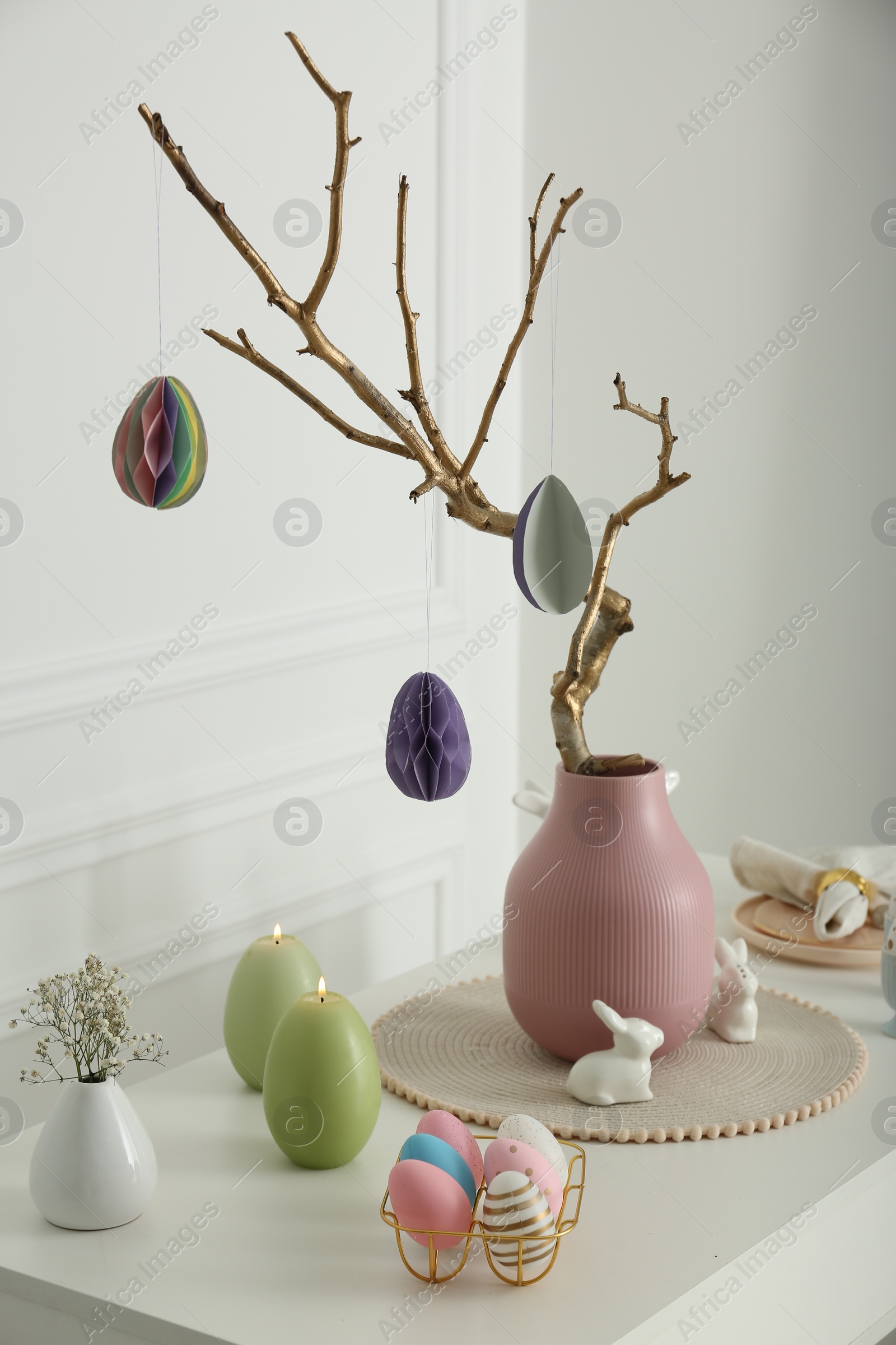 Photo of Beautiful festive composition with Easter decor on white table indoors