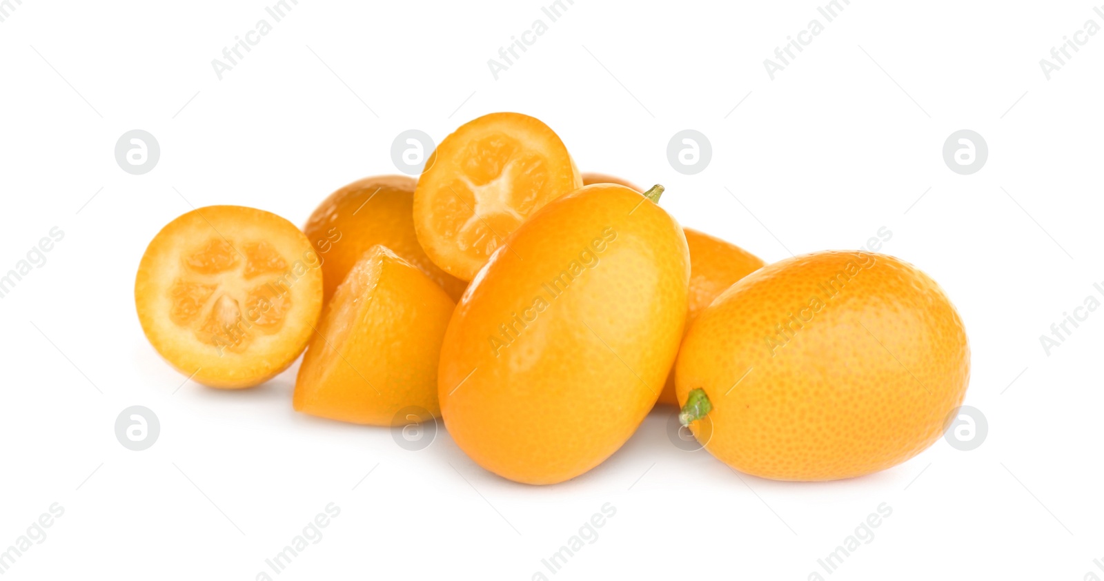 Photo of Whole and cut ripe kumquats on white background. Exotic fruit