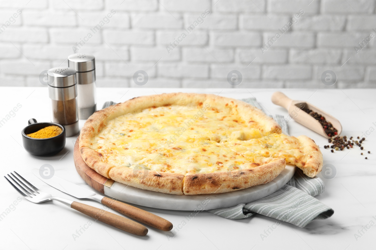 Photo of Delicious cheese pizza served on white table