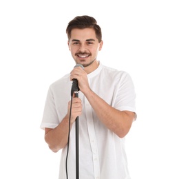 Young handsome man posing with microphone on white background