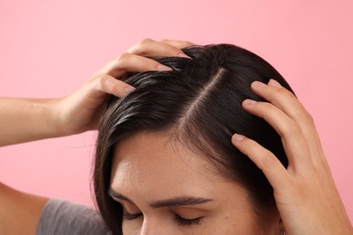 Photo of Woman with healthy hair on pink background, closeup