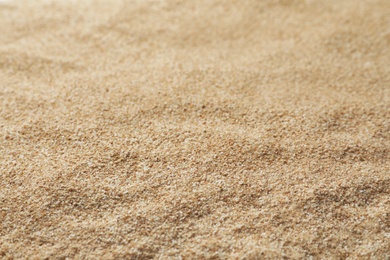 Photo of Buckwheat flour as background, closeup. Gluten free product
