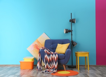 Photo of Modern bright interior with comfortable blue armchair