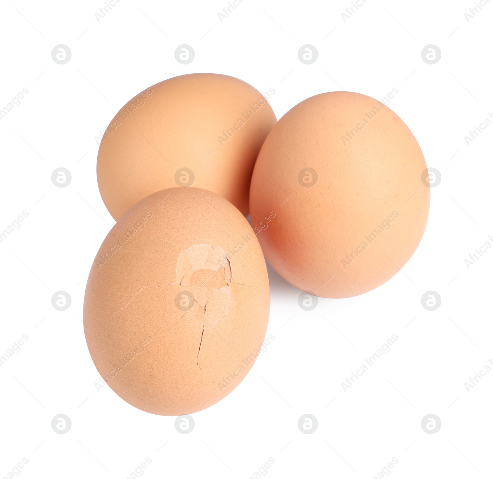 Photo of Whole and cracked chicken eggs isolated on white