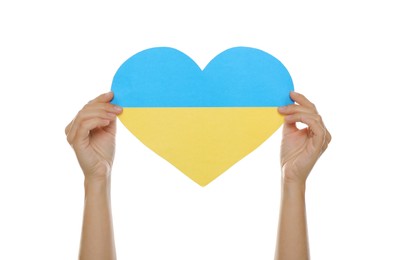 Photo of Woman holding paper heart in colors of Ukrainian flag on white background, closeup