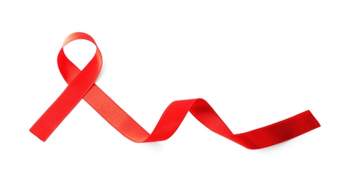 Photo of Red ribbon isolated on white, top view. AIDS disease awareness