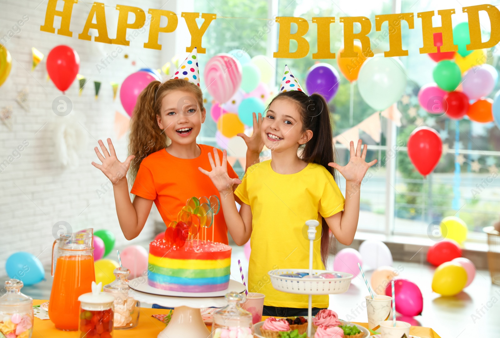 Photo of Happy children at birthday party in decorated room