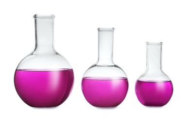 Photo of Florence flasks with purple liquid on white background