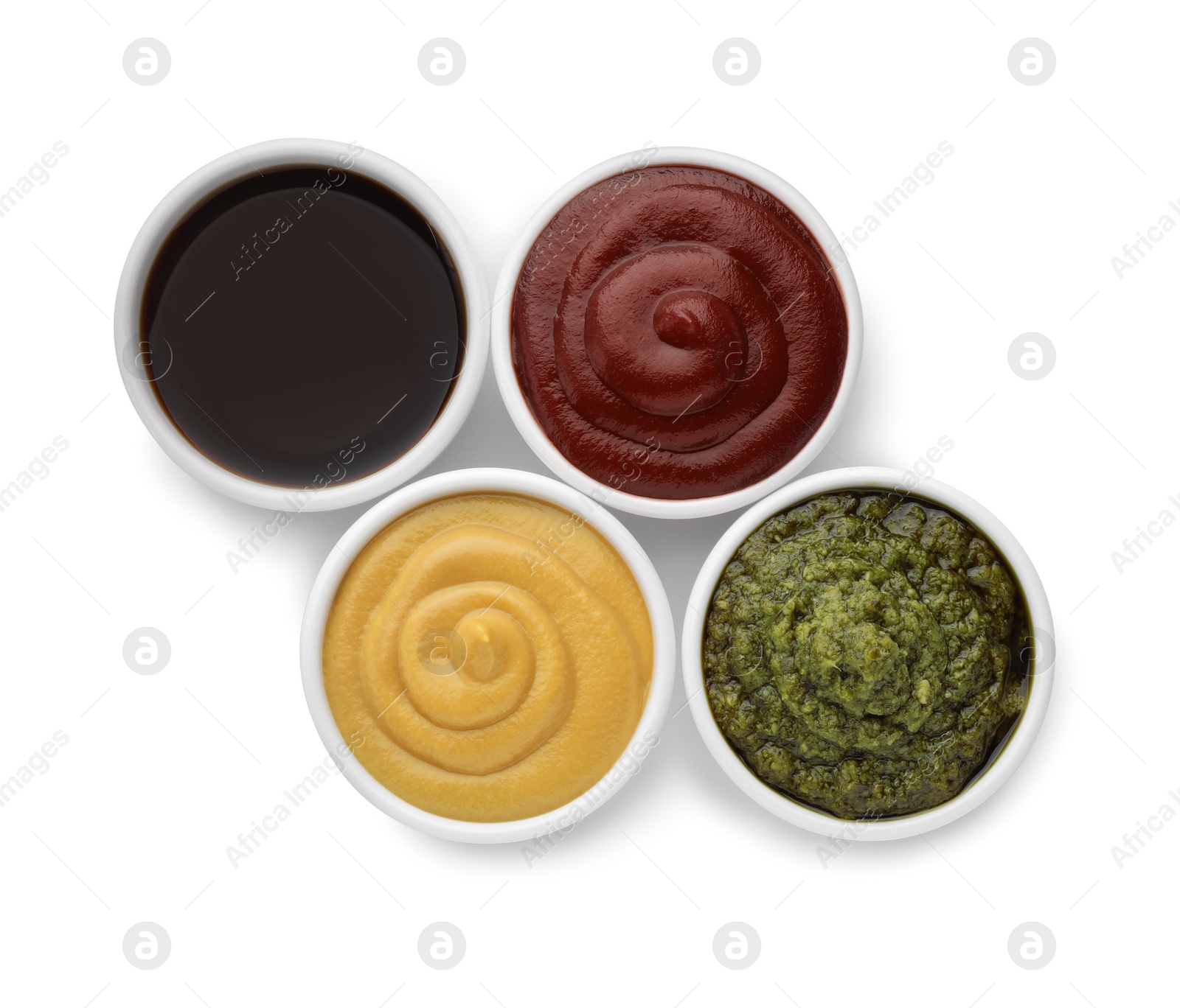 Photo of Many different sauces in bowls on white background, top view