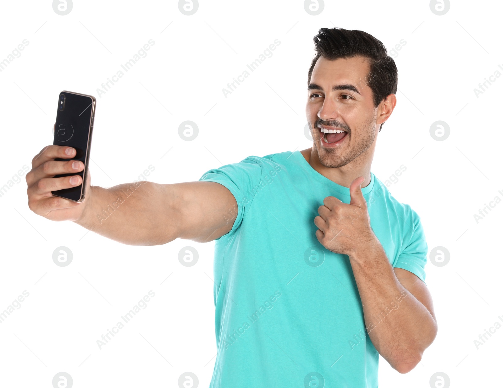 Photo of Happy young man taking selfie on white background