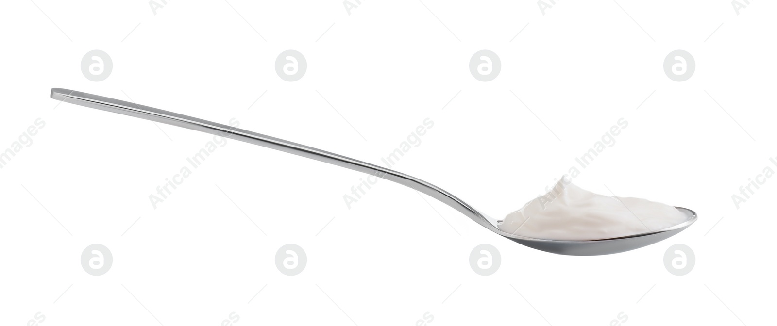 Photo of One silver spoon with sour cream isolated on white