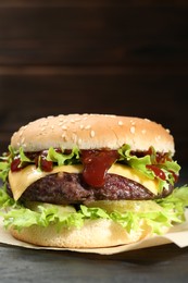 Photo of Burger with delicious patty on table, closeup
