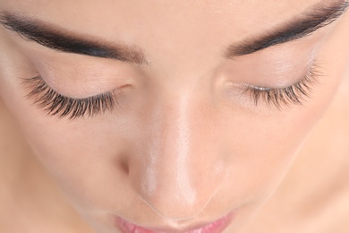 Young woman with beautiful eyelashes, closeup view