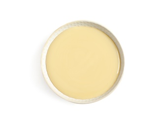 Photo of Bowl with condensed milk on white background, top view. Dairy product