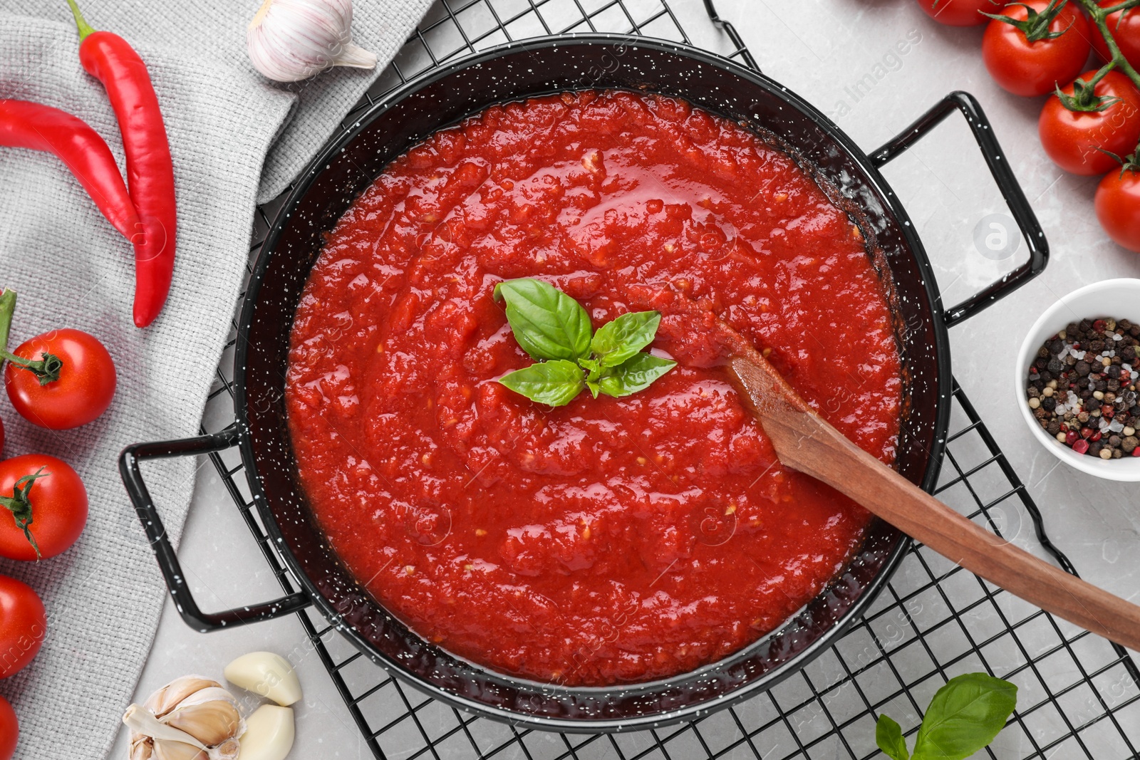 Photo of Delicious tomato sauce in pan on table, flat lay