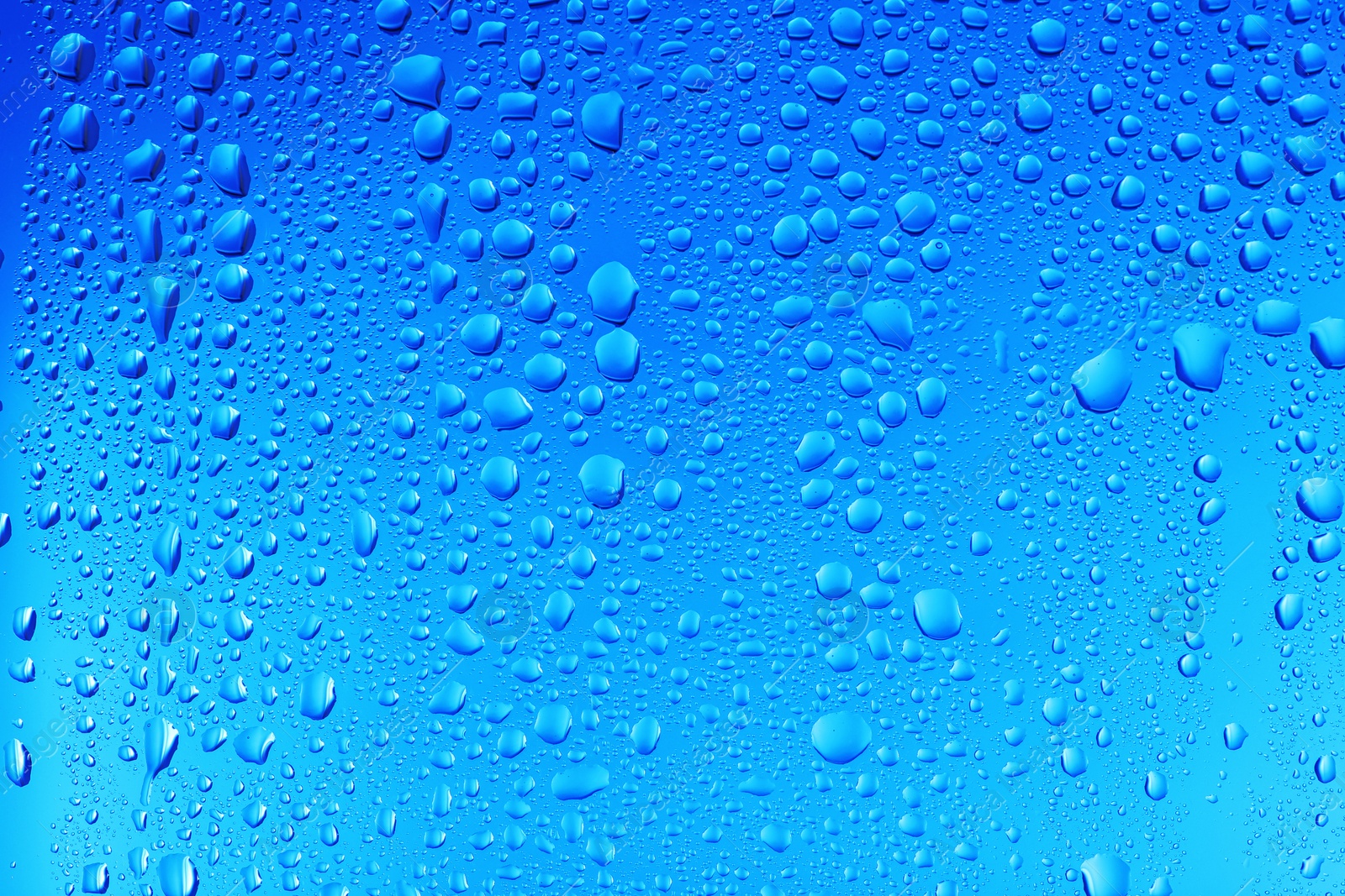 Photo of View of glass with water drops, closeup