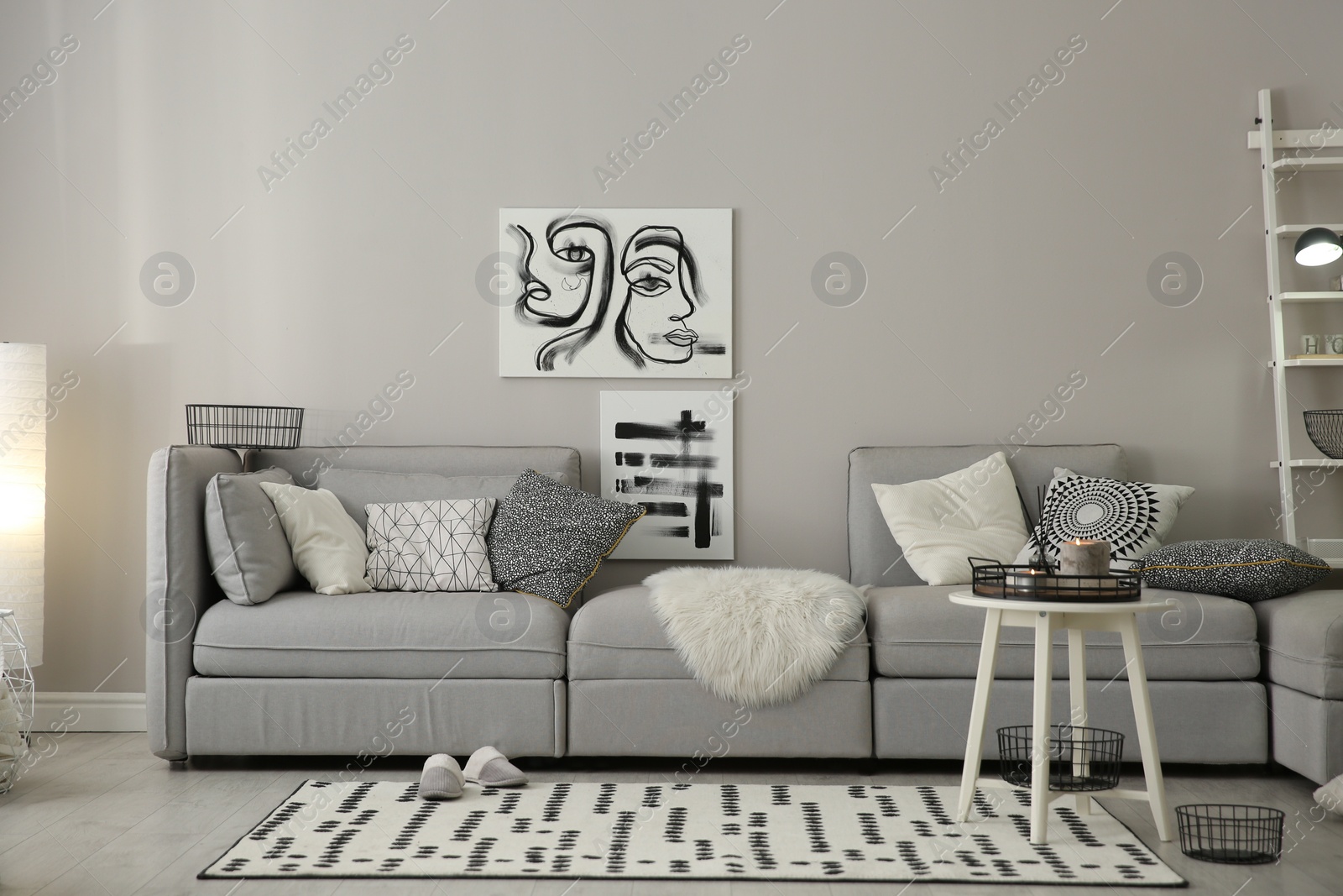 Photo of Cozy living room interior with big grey sofa