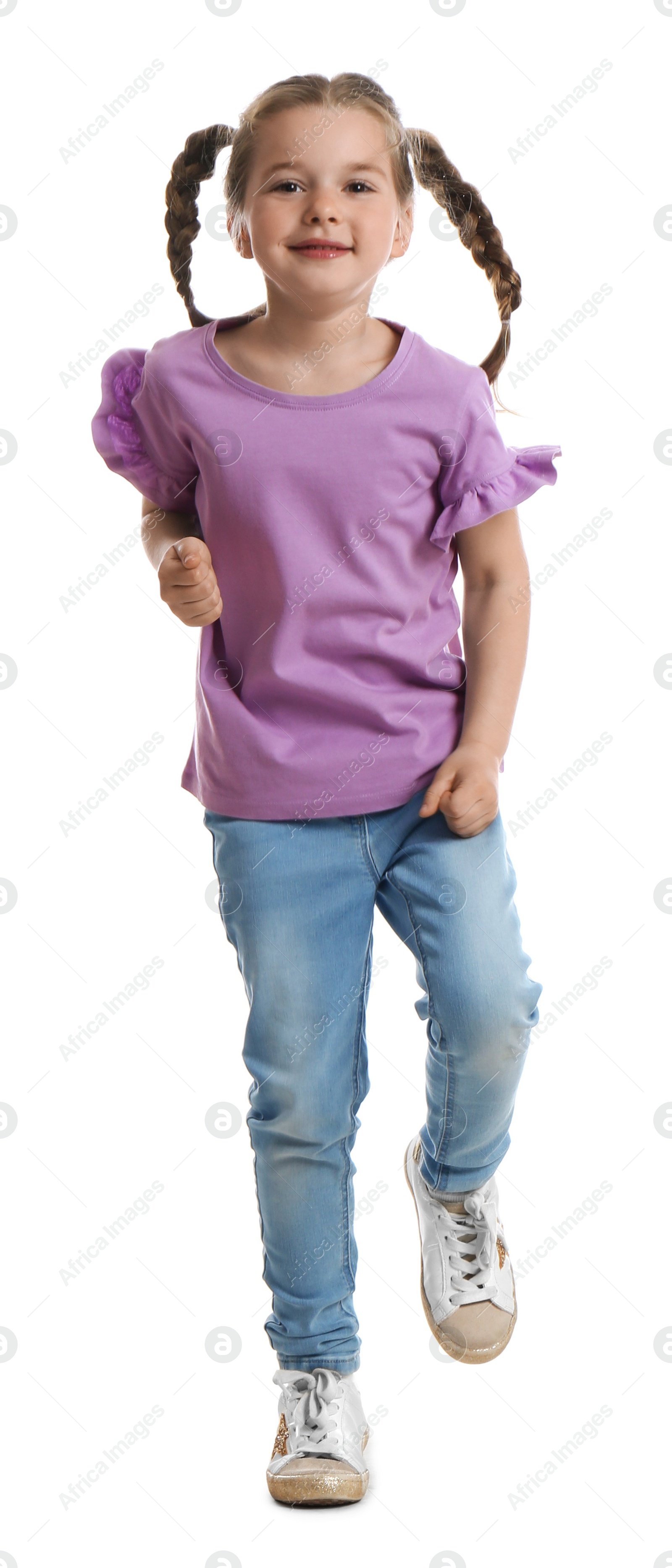 Photo of Cute little girl running on white background