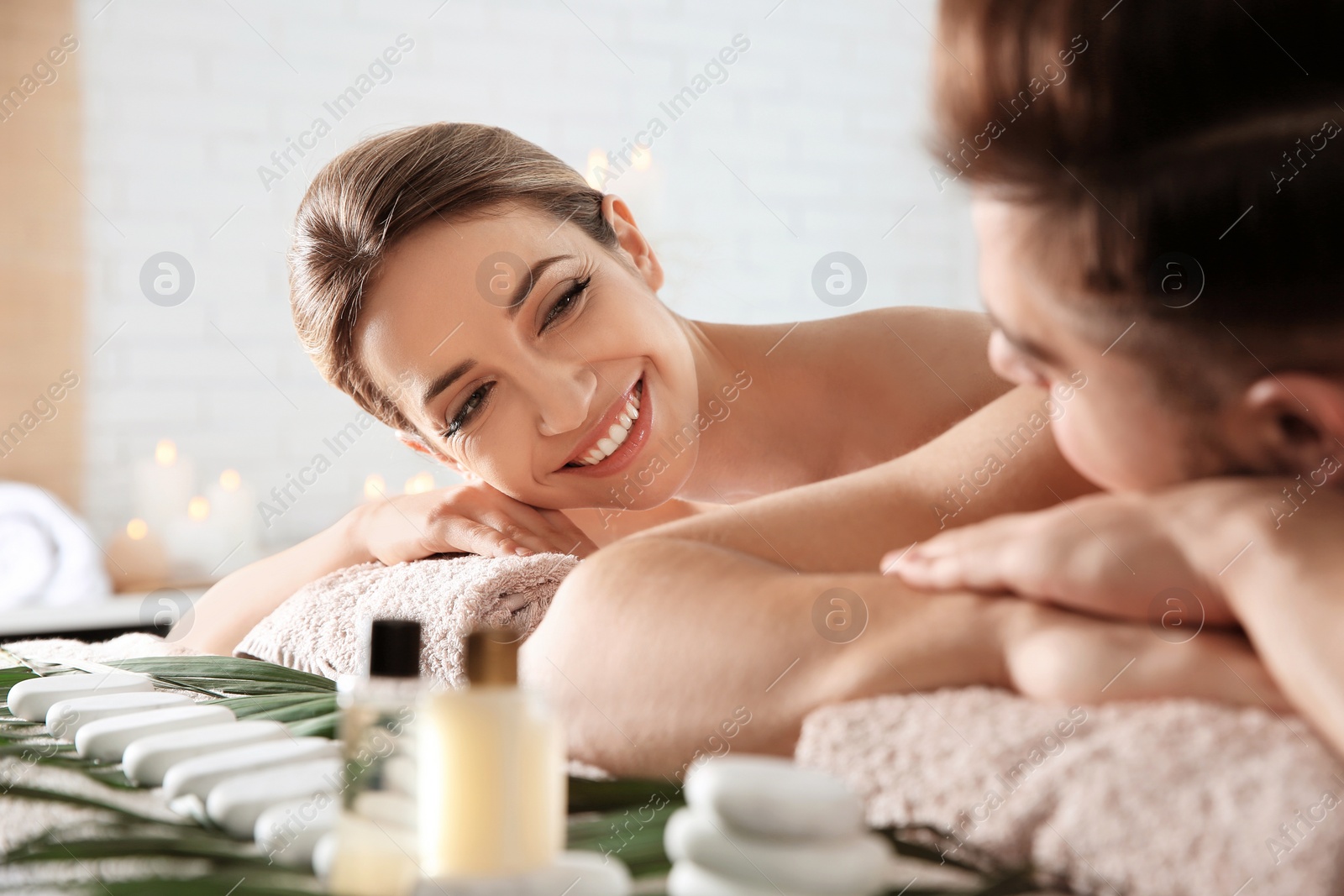 Photo of Romantic young couple relaxing in spa salon