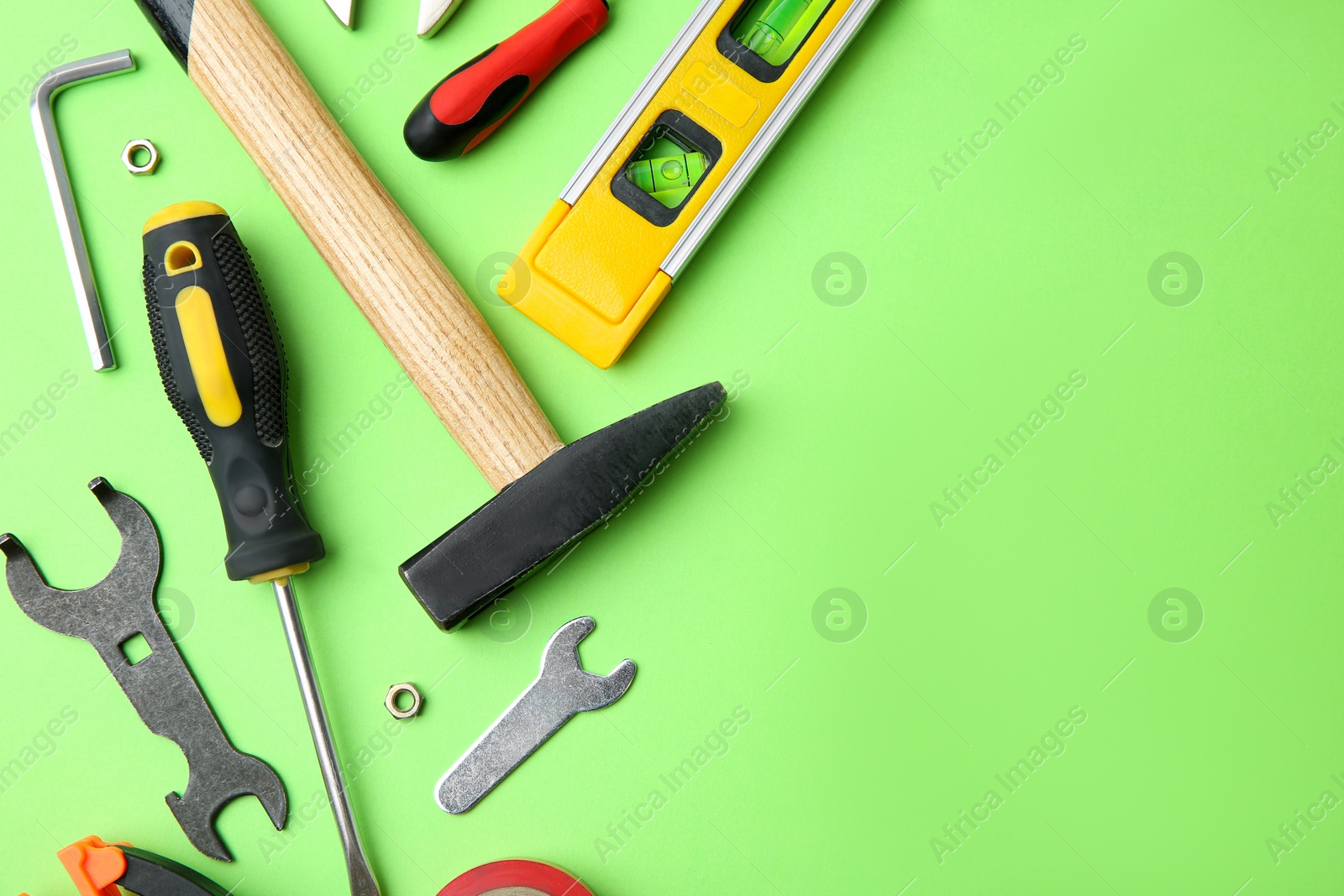 Photo of Set of repair tools on light green background, flat lay. Space for text