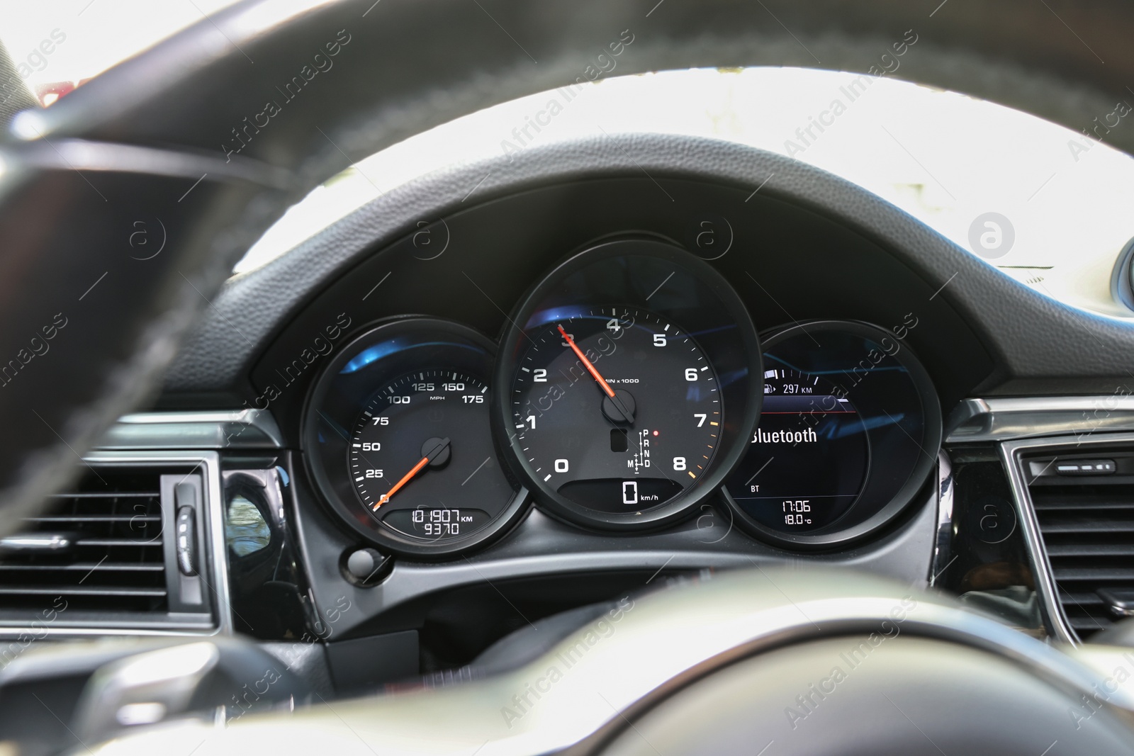 Photo of Speedometer and tachometer inside of modern car, closeup