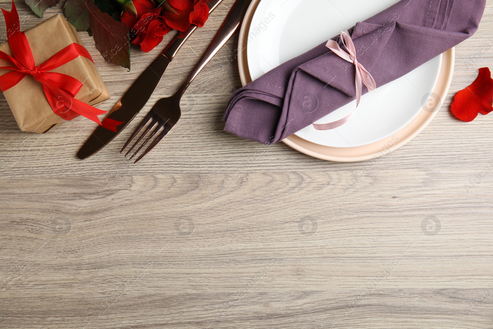 Photo of Beautiful place setting on wooden table, flat lay with space for text. Valentine's day romantic dinner