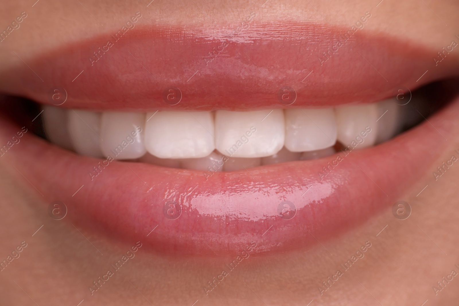 Photo of Woman with beautiful lips smiling, closeup view