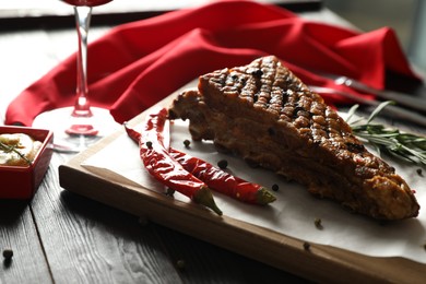 Delicious roasted ribs served on wooden table