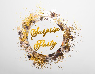 Image of Surprise party. Many shiny confetti on white background, top view