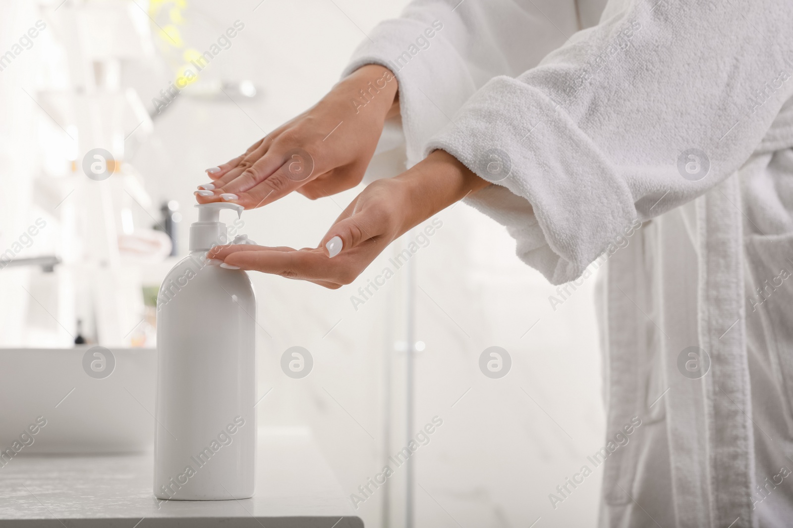 Photo of Teenage girl using gel in bathroom, closeup. Skin care cosmetic