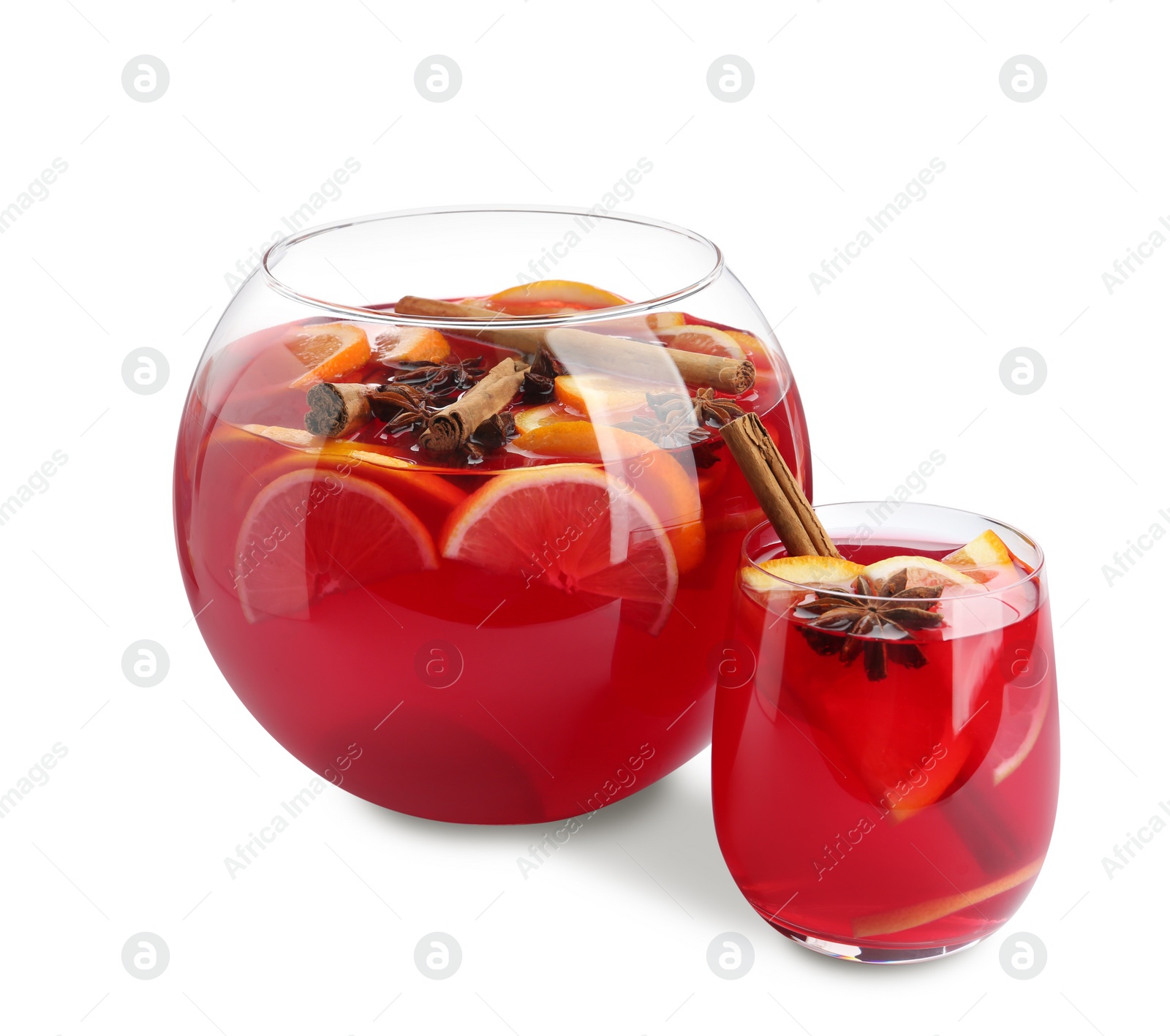 Photo of Glass and bowl of delicious aromatic punch drink on white background