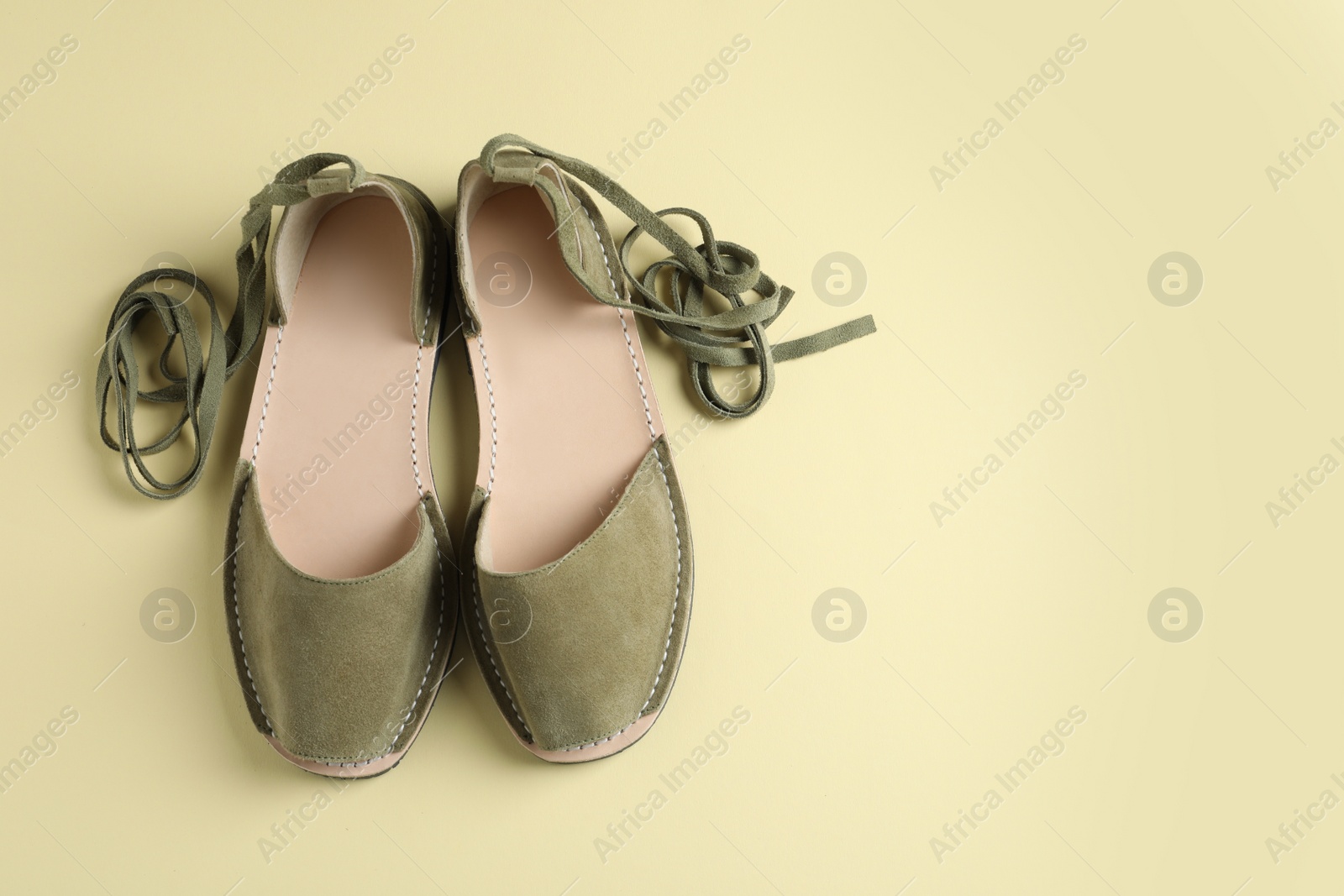 Photo of Pair of trendy women's shoes on color background