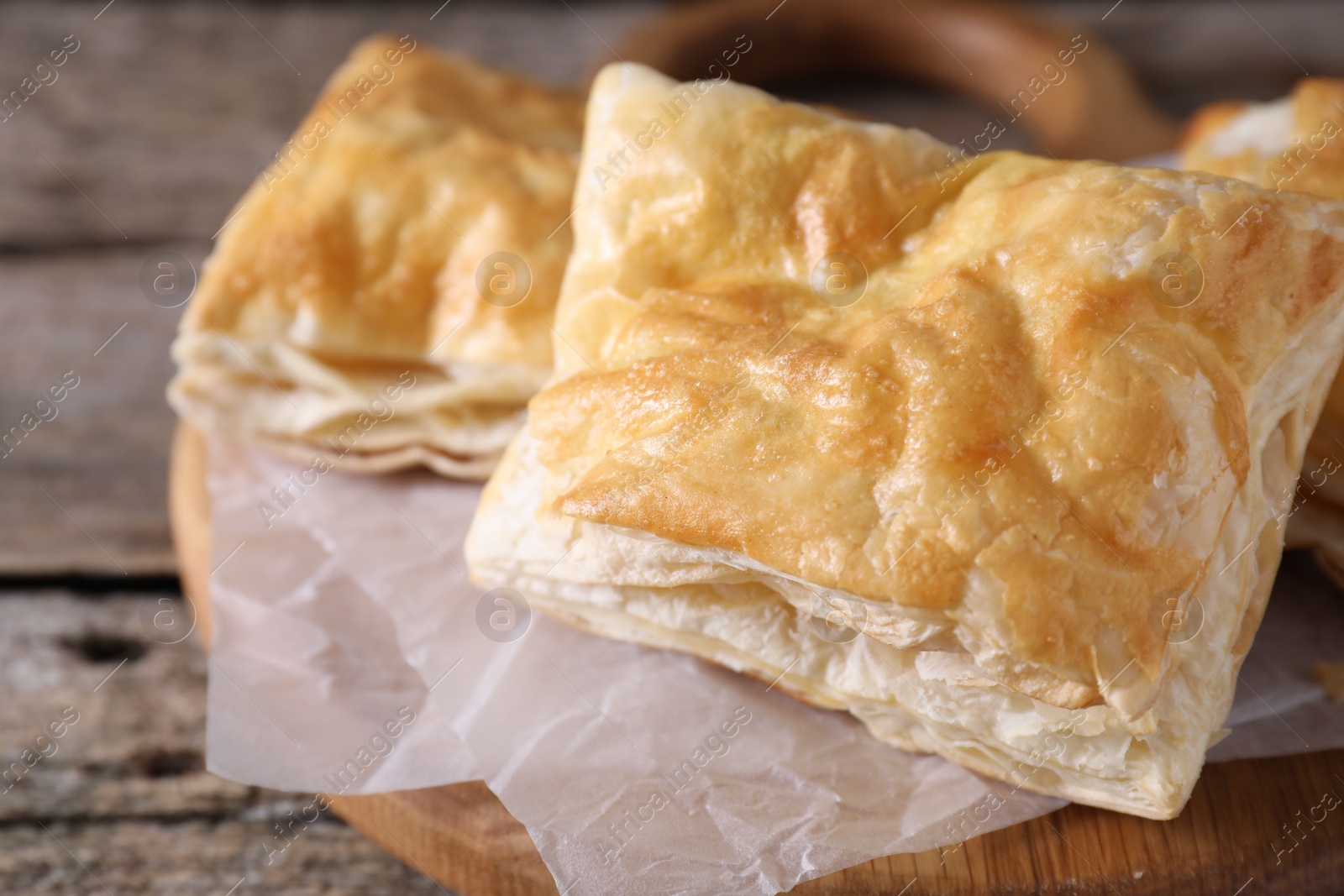 Photo of Delicious puff pastry on table, closeup view