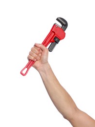 Photo of Male plumber holding pipe wrench on white background, closeup