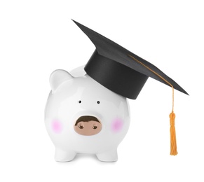 Photo of Piggy bank in graduation hat with gold tassel isolated on white
