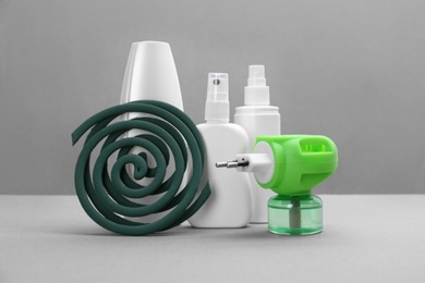 Photo of Set of different insect repellents on grey background