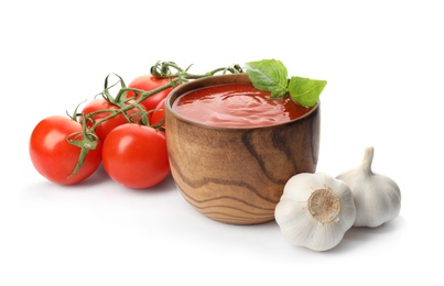 Composition with bowl of tomato sauce and vegetables isolated on white