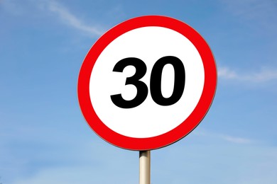 Image of Road sign Maximum speed limit against blue sky