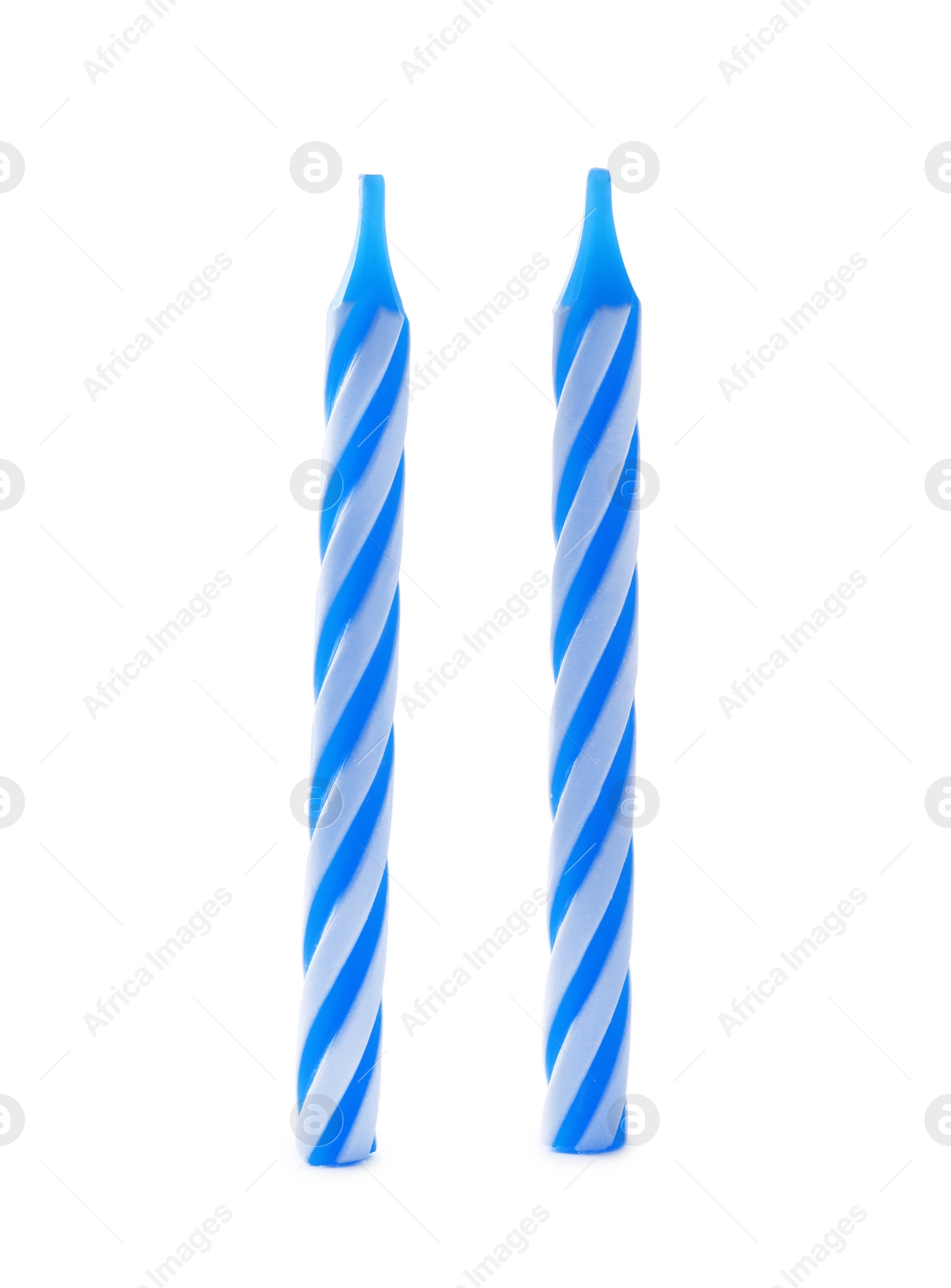 Photo of Blue striped birthday candles isolated on white