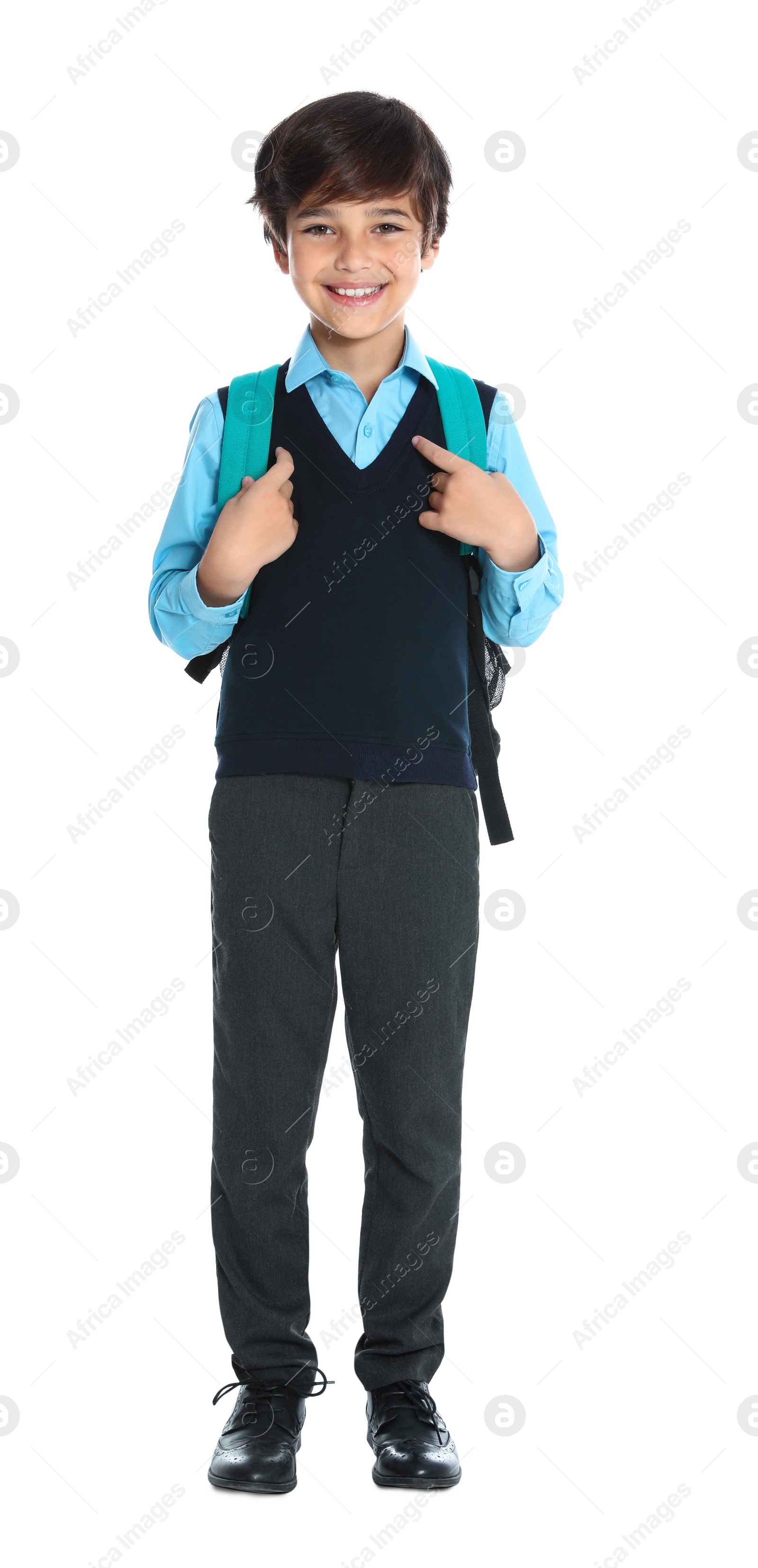 Photo of Happy boy in school uniform on white background