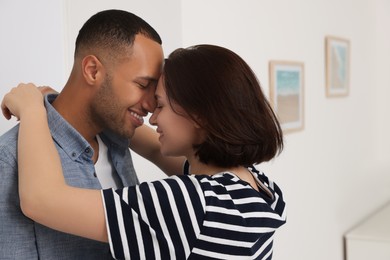 Photo of Dating agency. Happy couple enjoying time together at home