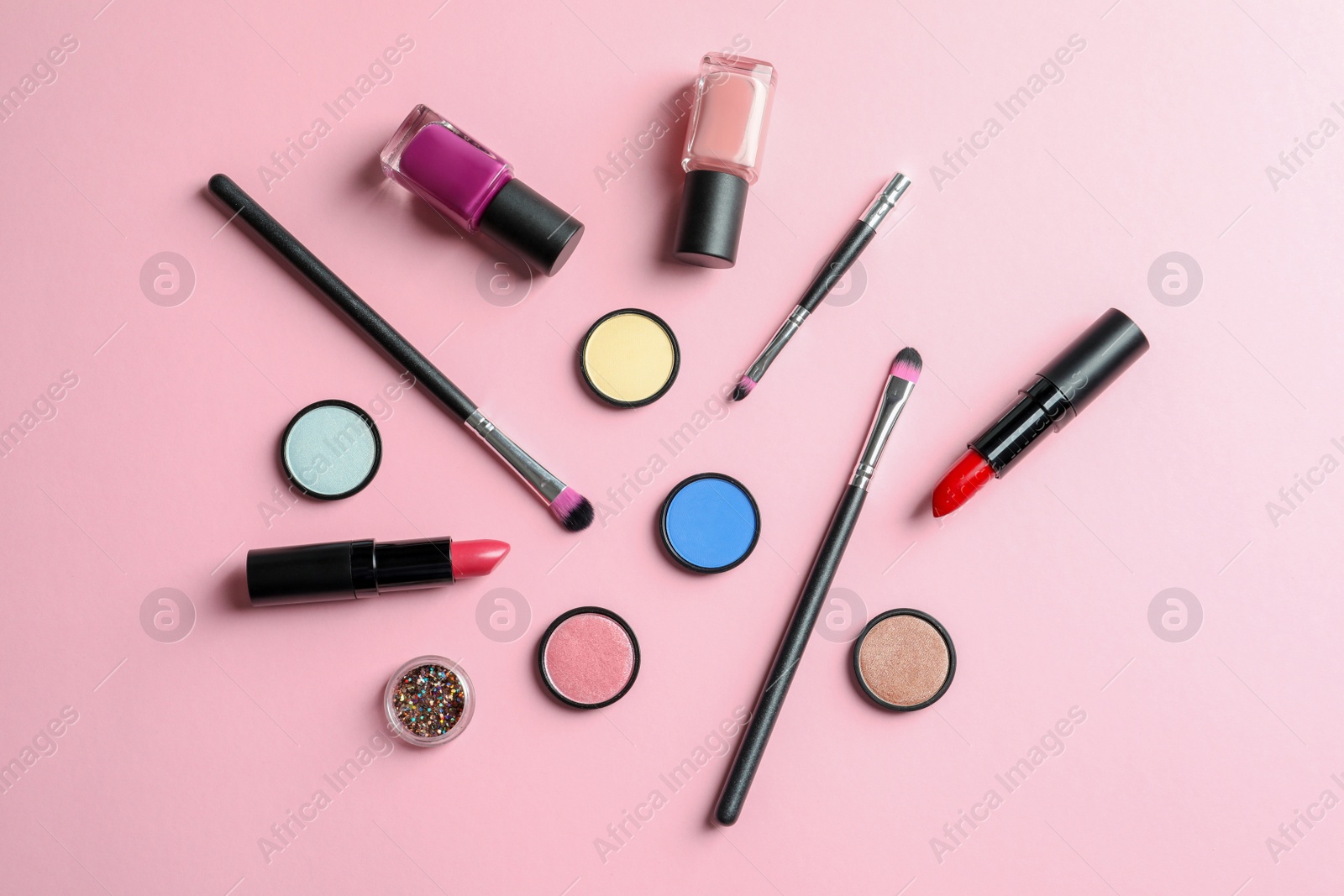 Photo of Flat lay composition with decorative cosmetics on color background