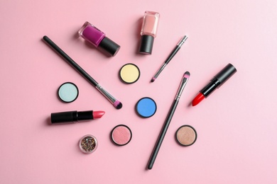 Flat lay composition with decorative cosmetics on color background