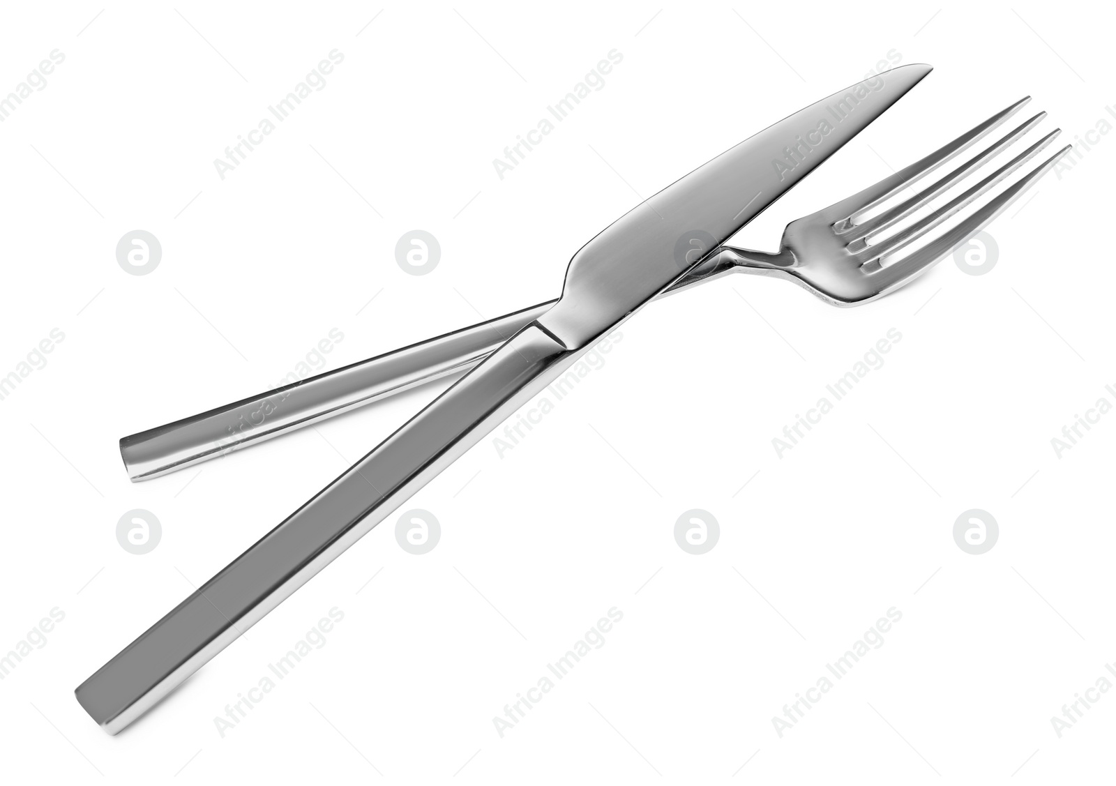 Photo of Fork and knife isolated on white. Stylish shiny cutlery set