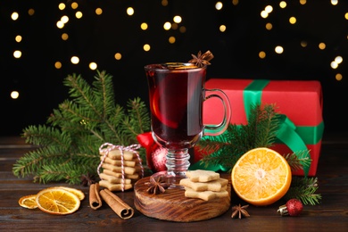 Christmas composition with aromatic mulled wine on wooden table