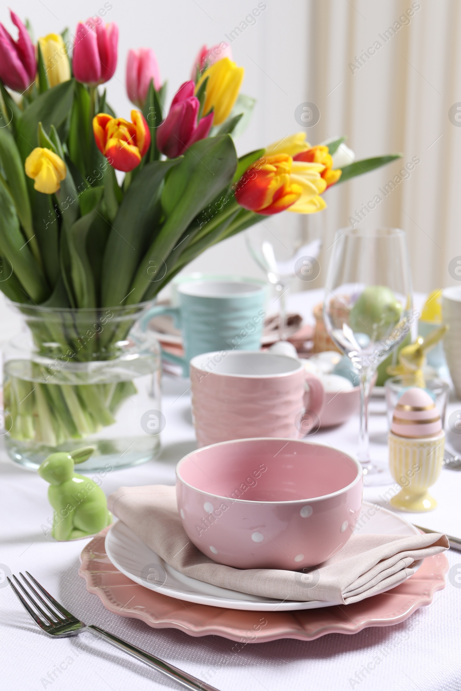 Photo of Festive table setting with beautiful flowers. Easter celebration