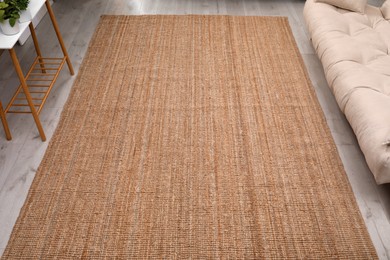 Photo of Stylish carpet on floor in living room, above view