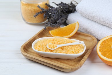 Photo of Sea salt, lavender, orange and towels on white wooden table