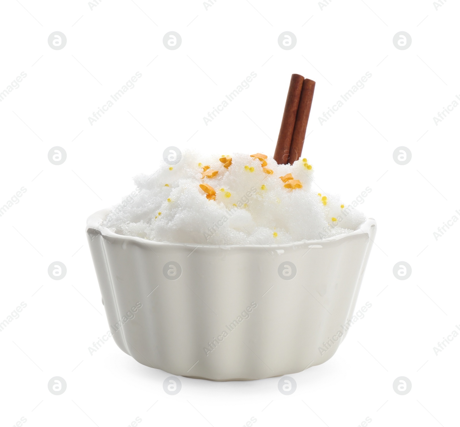 Photo of Snow ice cream with sprinkles and cinnamon in bowl on white background